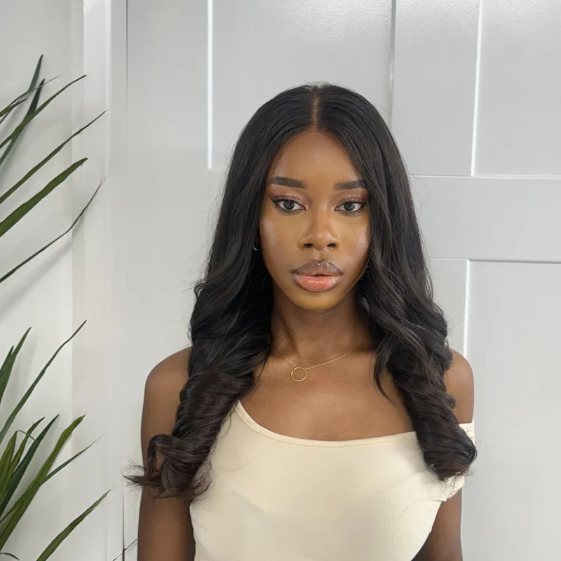 Brazilian - human - hair wig with a full and voluminous lookKEMI- Long Luxury Raw Human Hair Lace Closure Wig