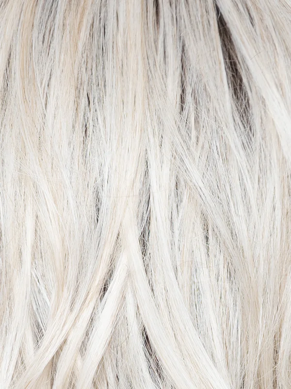 White Rose Blond R | White blond base with subtle warm brown highlights. The medium-brown root creates a vibrant appearance.